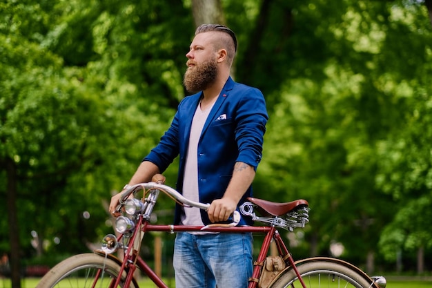 Close up image of a man on a retro bicycle.