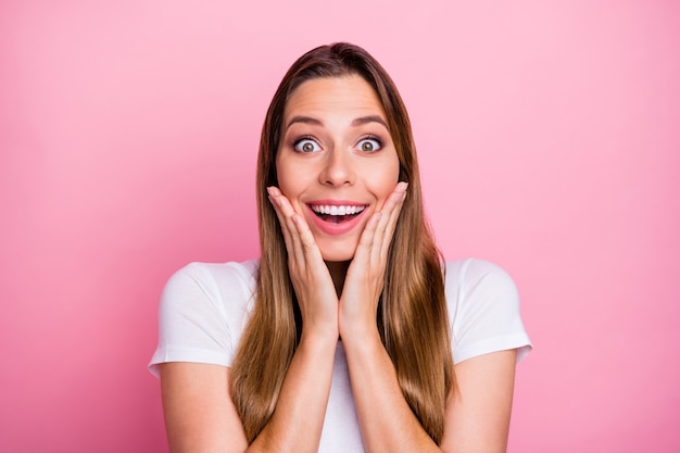 Close up  of impressed enthusiastic girl hear wonderful black friday sales news touch face hands shout wear good looking clothes 