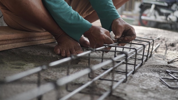 close up installing concrete steel reinforcement used for the casting process