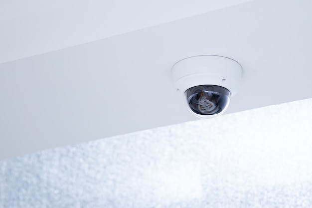 Close-up IP surveillance camera on the ceiling.