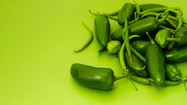 Close-up jalapenos with green background