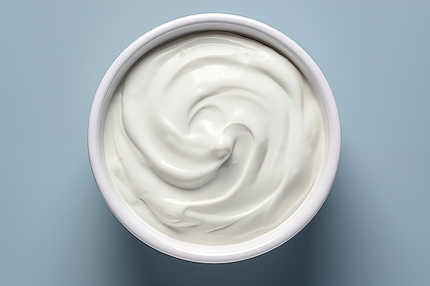 close up of a jar of cream on a blue background