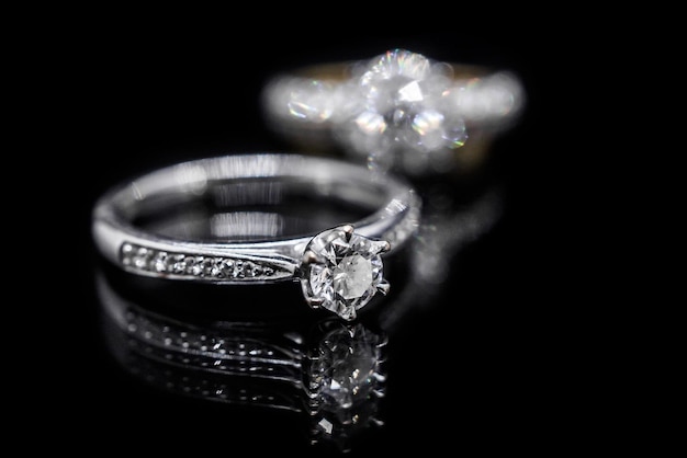 Close up Jewelry diamond ring on black background with reflection