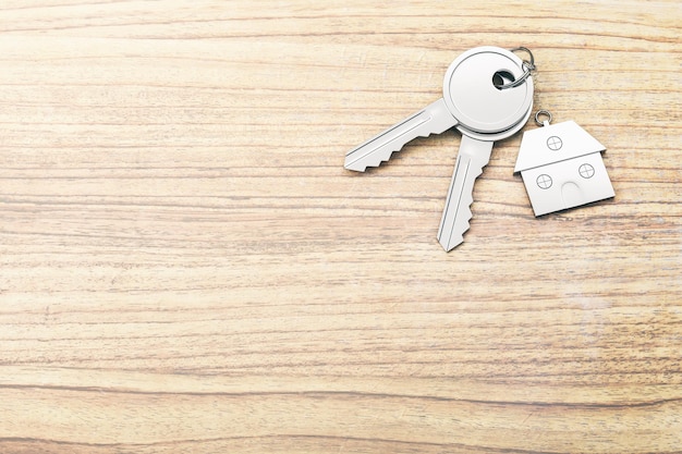 Close up of keys with house keychain on wooden surface background with mock up place Real estate and property concept 3D Rendering