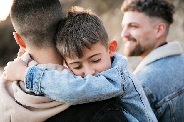 Close up kid hugging father