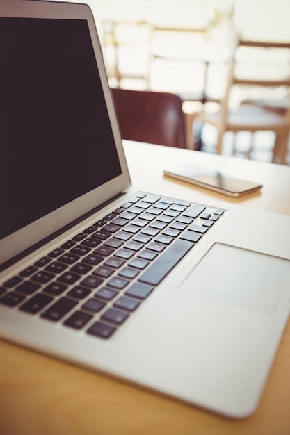 Close-up of laptop and mobile phone on a table