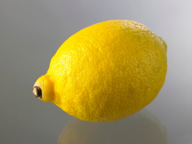 Close-up of lemon on glass