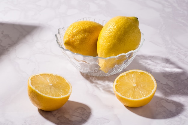 Close up lemons in a glass bowl