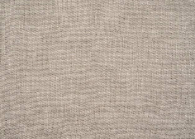 Close-up linen texture of natural beige organic fabric or cloth