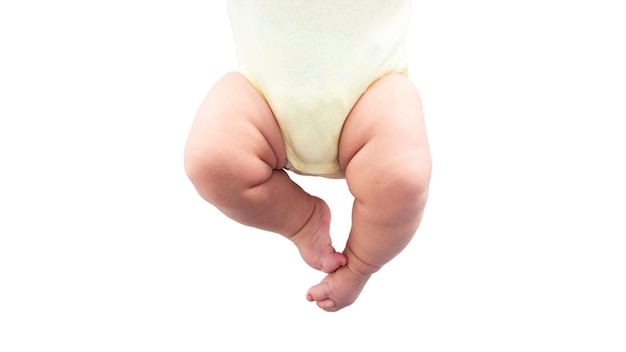 Close up little tiny baby with chubby legs over a sheets bed Peace calm infant