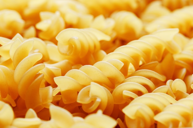 Close-up of long, thick, corkscrew-shaped pasta screw