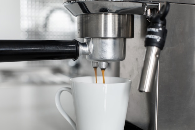 Close-up of making coffee in a coffee machine.