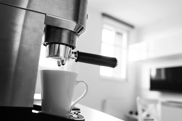 Close-up of making coffee in a coffee machine.