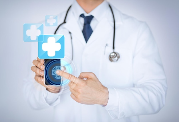 close up of male doctor holding smartphone with medical app