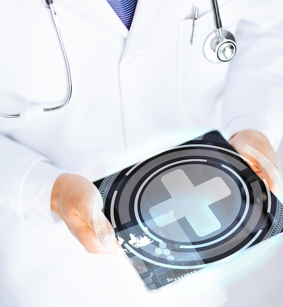 close up of male doctor holding tablet pc with medical app