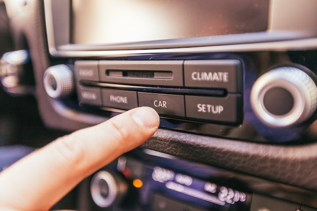 Close-up of a male hand  in a modern car