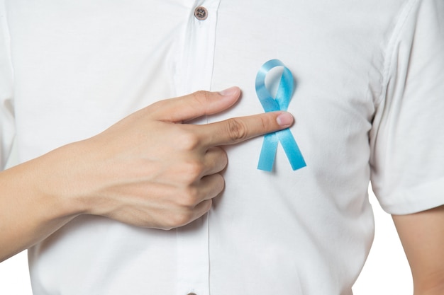 close up of male hand pointing to light blue ribbon for prostat