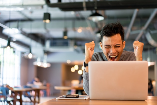 close up man exited and happy when watching digital TV 