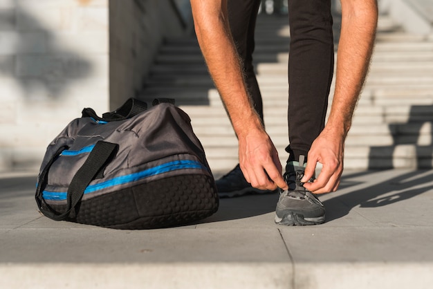 Photo close-up of man getting ready to run