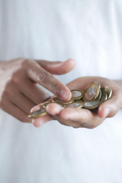 Close up of man hand counting coins