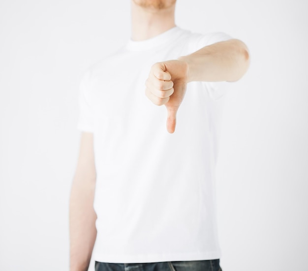 close up of man hand showing thumbs down