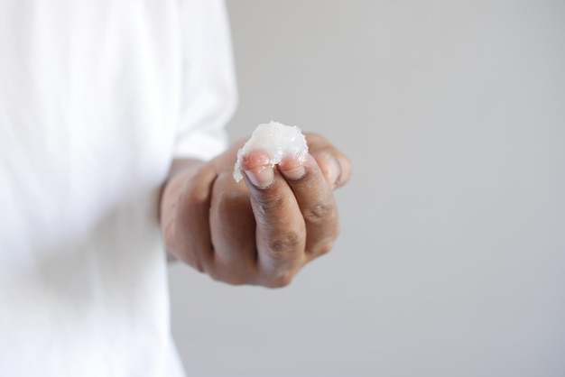 Close up of man hand using petroleum jelly