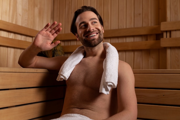 Close up on man relaxing in the sauna