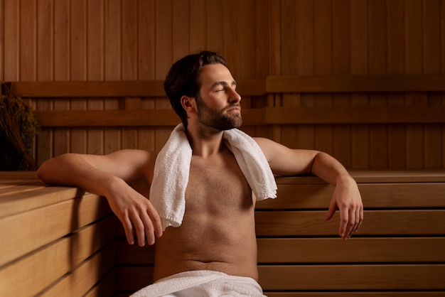 Close up on man relaxing in the sauna