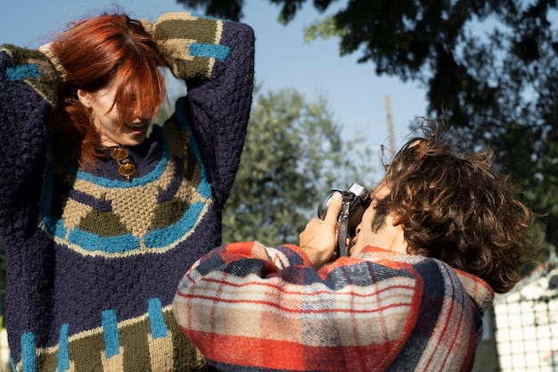 Close up man taking photos with camera