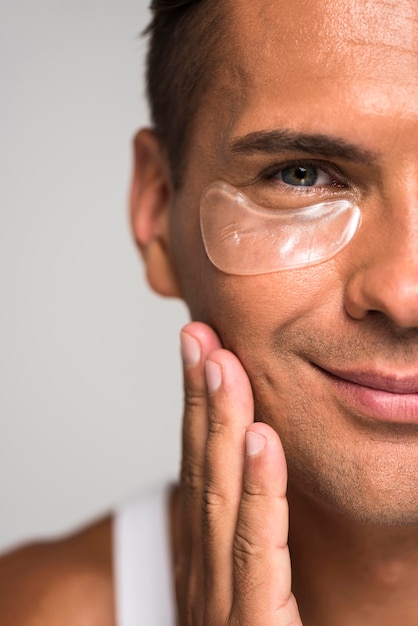 Close-up man with under eye patch