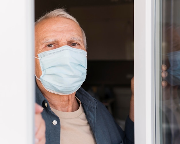 Close-up man with medical mask