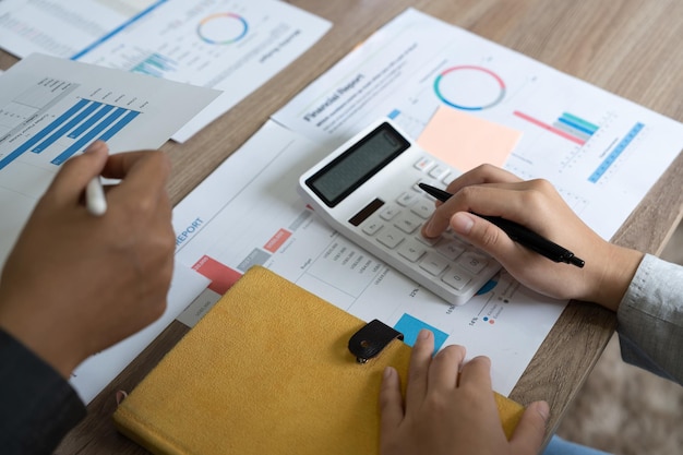 Close up a man working about financial with calculator at his office to calculate expenses Accounting concept