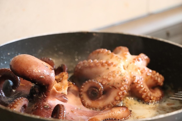 Close-up of meat in cooking pan