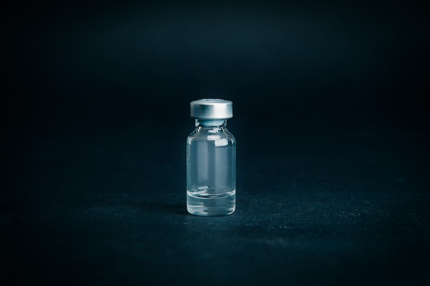 Close up. medical ampoule on a dark