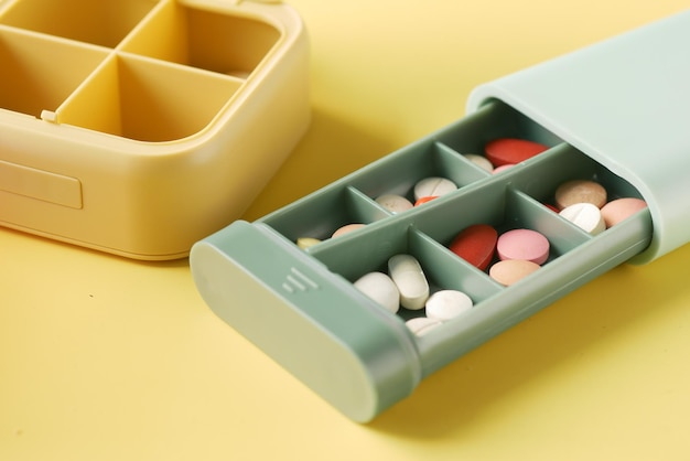 Close up of medical pills in a pill box on table