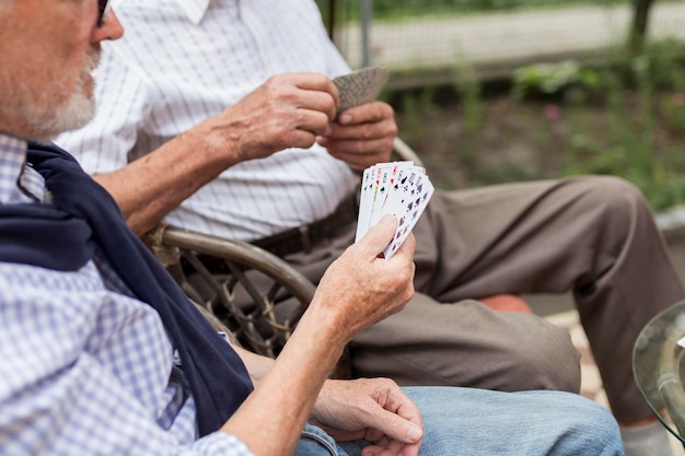 Close-up men playing cards