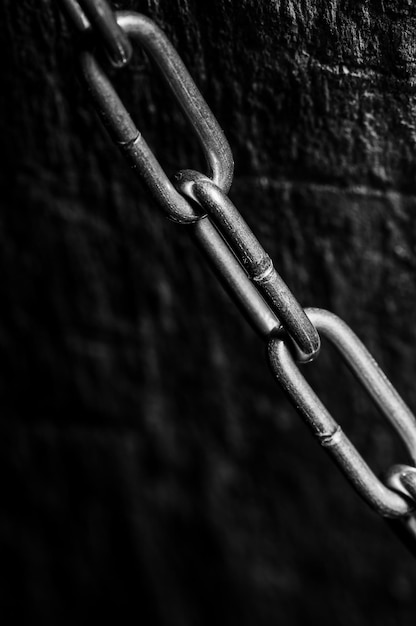 Close up of metal chain part backgroundchain macro on cold brushed metal heavy duty chain