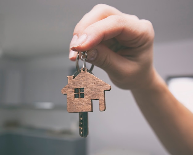 Close up on metal key in woman's hand