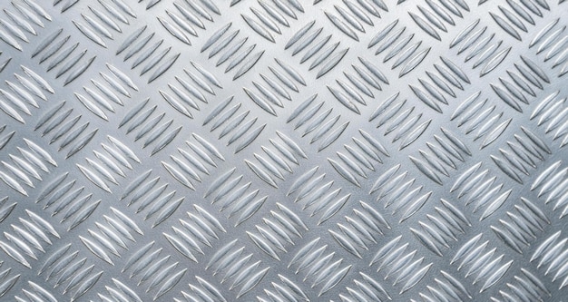 a close up of a metal sheet with a pattern of lines that say  the company