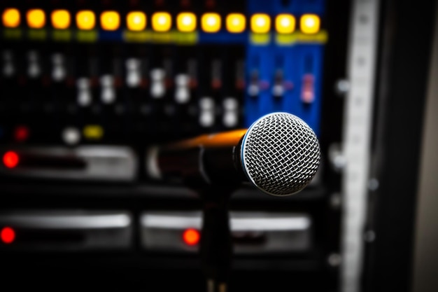 Close up microphone and blur sound mixer background