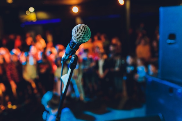 Close up of microphone in concert hall or conference room.