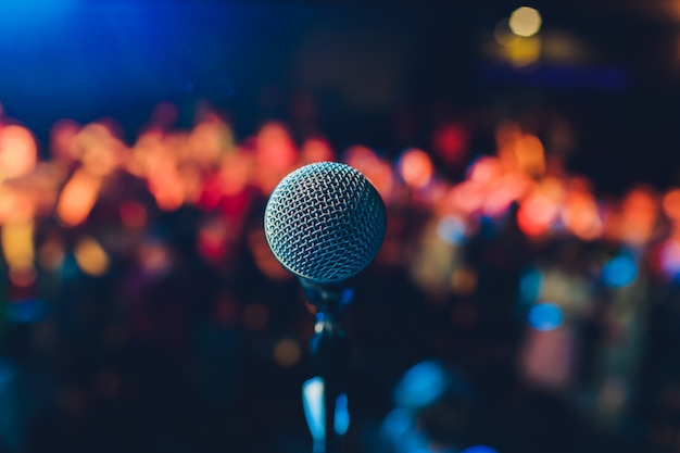 Close up of microphone in concert hall or conference room.