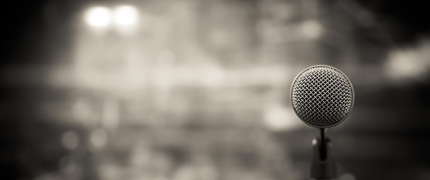 Close-up the microphone on stand with blur background.