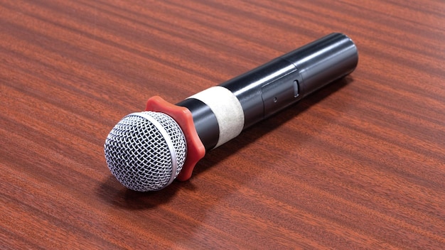 Close up Microphone on the table concept of speaker or teacher preparation to speak in seminar class room