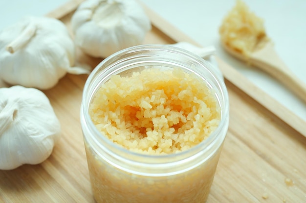 Close up of minced garlic in a container on table