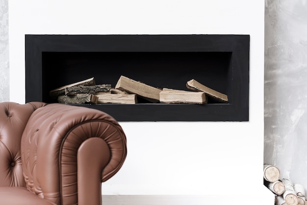 Close-up minimalist fireplace  and sofa