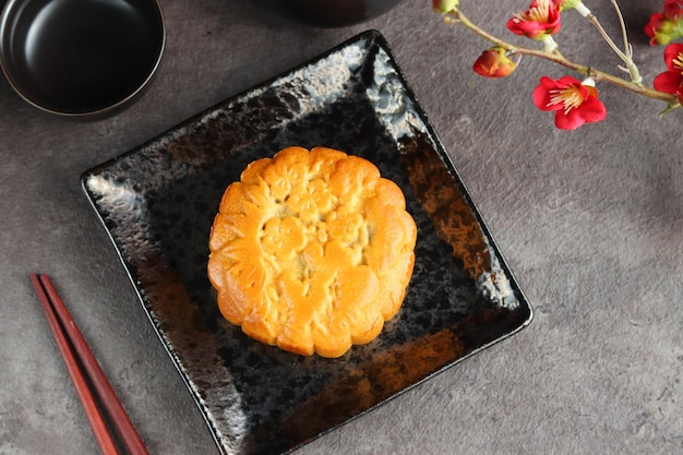 Close up moon cakes with black background. Mooncake is a traditional Chinese bakery.