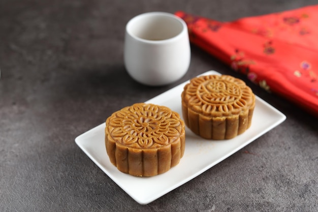 Close up moon cakes with black background. Mooncake is a traditional Chinese bakery