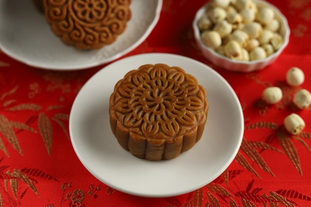 Close up moon cakes with red background. Mooncake is a traditional Chinese bakery