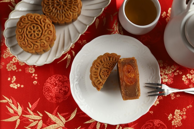 Close up moon cakes with red background. Mooncake is a traditional Chinese bakery.